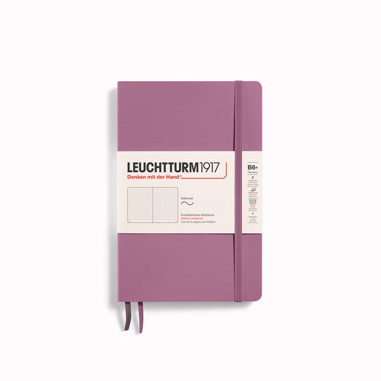 The B6+ Softcover Dotted Notebook features 2 page markers, a blank table of contents, numbered pages, a gusseted pocket for loose notes and business cards, an elastic enclosure band