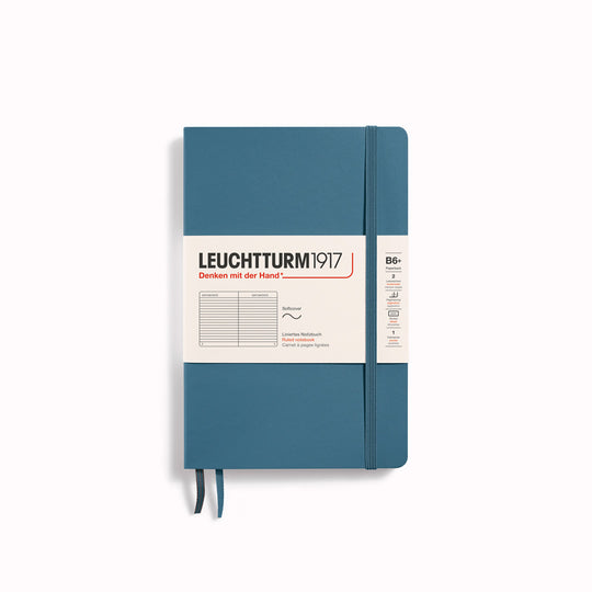 The B6+ Hardcover Lined Notebook features 2 page markers, a blank table of contents, numbered pages, a gusseted pocket for loose notes and business cards