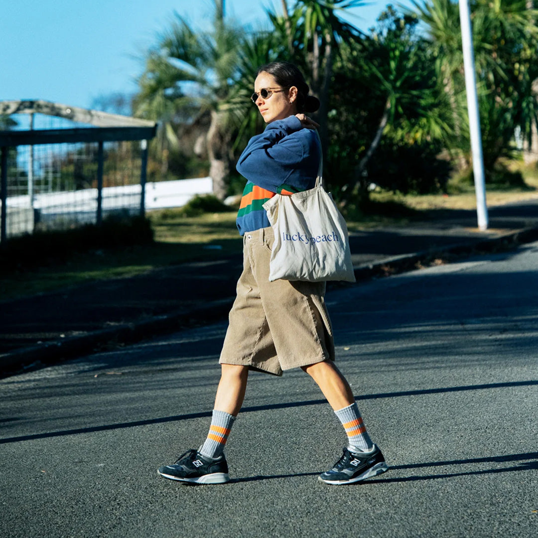 Introducing the Rototo Pile Stripe Marl Socks in Blue and Orange, a perfect blend of style and comfort.