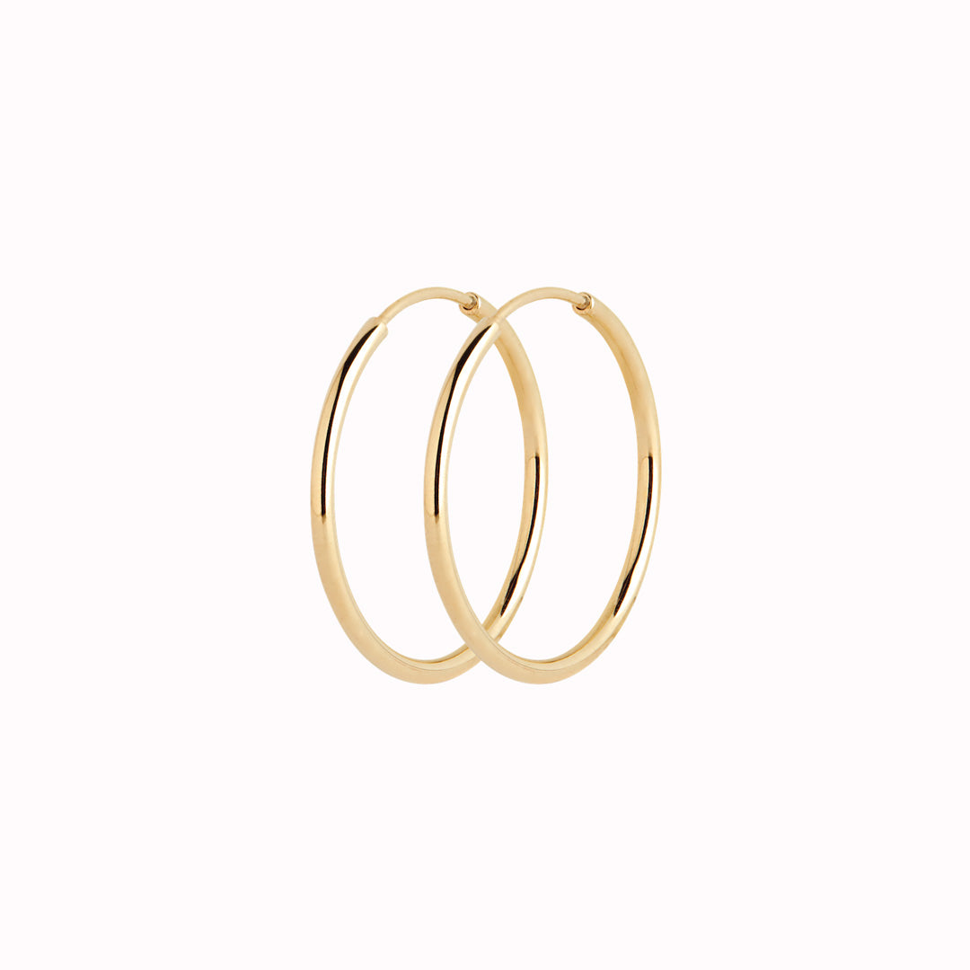These Classic hoops from Maria Black are made from Sterling Silver and available with either White Rhodium plating or 22k Gold Plate.