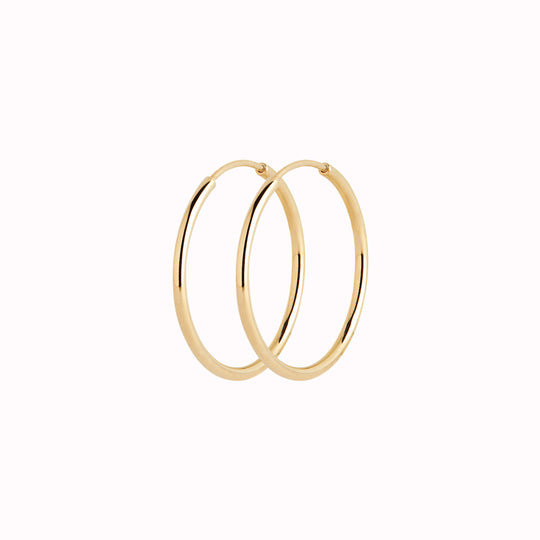 These Classic hoops from Maria Black are made from Sterling Silver and available with either White Rhodium plating or 22k Gold Plate.