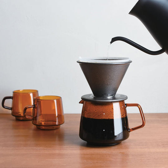 Sepia 4 cup jug with Slow Coffee filter holder being filled from Pour Over Kettle