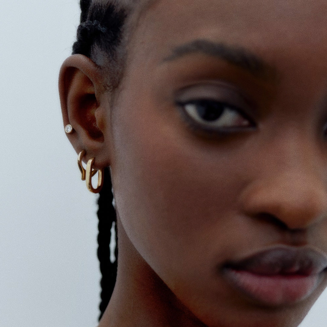 geometrically shaped Slick Huggie earring. It is perfect on its own but also stacks well with other earrings and charms creating a more personalised look