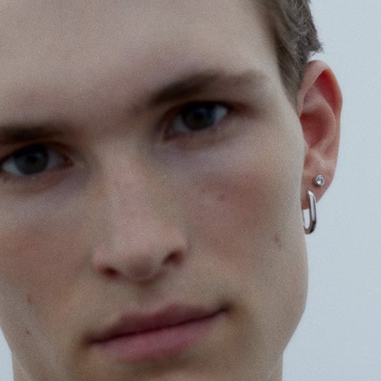 geometrically shaped Slick Huggie earring. It is perfect on its own but also stacks well with other earrings and charms creating a more personalised look