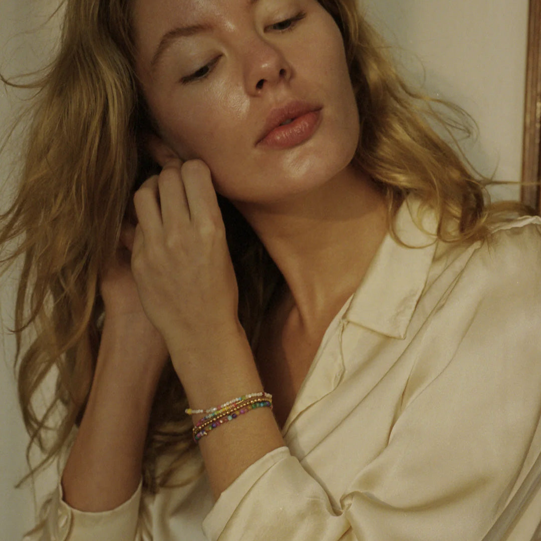 The Anni Lu Slim Goldie bracelet is a versatile piece of jewellery that offers a classic look when worn alone and layers with other pieces