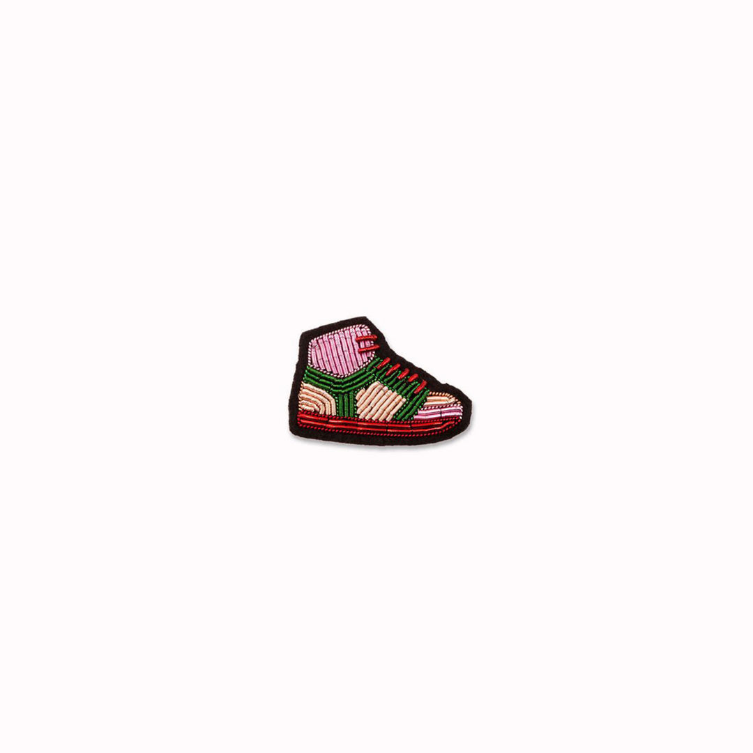 Sport Shoe is a hand embroidered decorative brooch from the Macon et Lesquoy summer 2024 collection, inspired by the 2024 Paris Olympics. An iconic sneaker style always in fashion