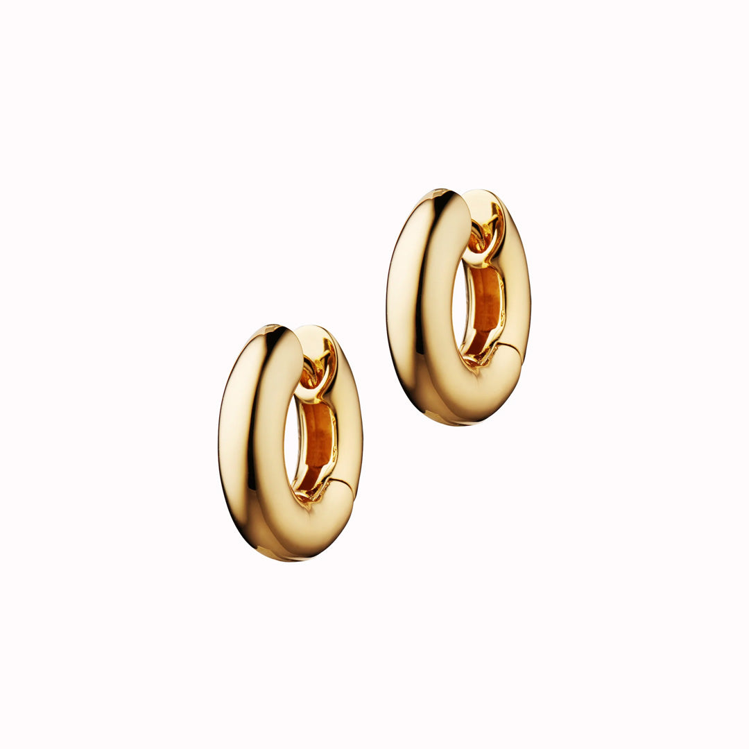 The Big O Hoops by Anni Lu displays the brand's commitment to elegance and playfulness. These hoops, crafted in brass with 24 Carat gold ion plating, are not only a statement of style but also a versatile accessory that can be paired with various charms