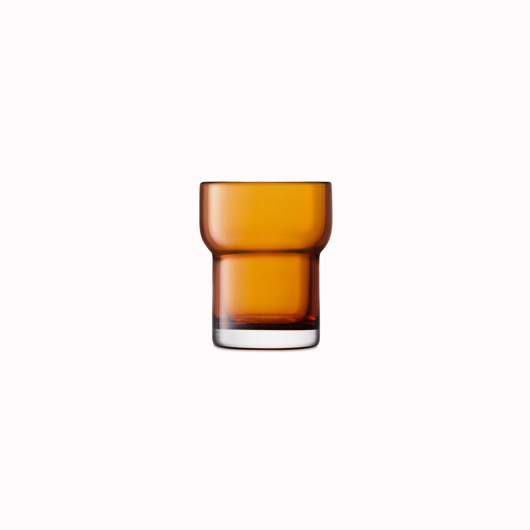 The Amber Utility Tumbler is a modern, step shaped mouth-blown tumbler made from amber coloured glass. Durable and versatile, this tumbler can be used for a variety of drinks including water, beer and short cocktails.