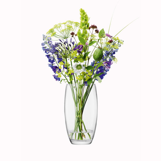 The 29cm Barrel Vase is a versatile, slender barrel shaped vase made from clear mouth blown glass. The Barrel Vase features a heavy base, thick walls and cut and polished rims with all finishing done by ha