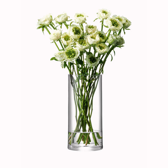 Lifestyle Image, The Column Vase from LSA is a contemporary, straight sided cylindrical vase made from clear mouth blown glass. The Column Vase features a heavy base, thick walls and cut and polished rims with all finishing done by hand.