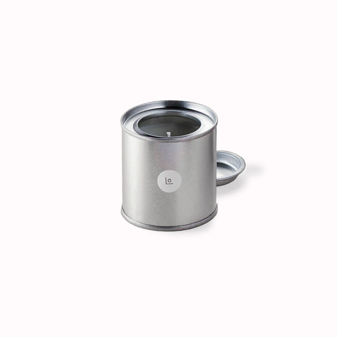 To the Sea scented candle from Lo Studio is inspired by imagined fragrances of the ocean. Saline and mysterious, it's a dream of the cove in ever shifting colours borrowed from the sea. The 125g Travel Candle is housed in a convenient and transportable tin.