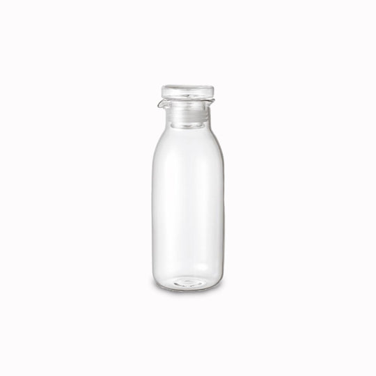 Large heat resistant glass bottle with air tight lid and pourer, suitable for salad dressing. Silicone rim on lid for a snug fit from Kinto - Japanese Tableware