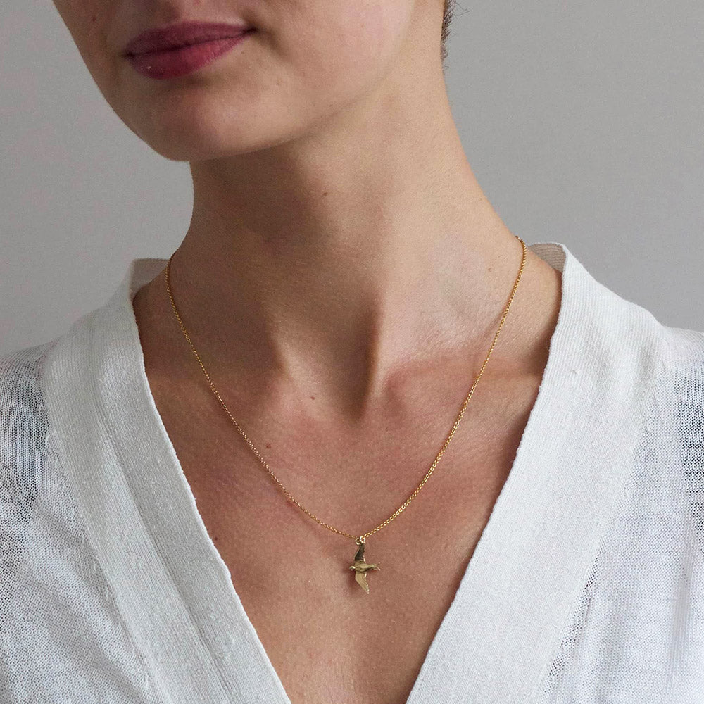 A delicately detailed flying swallow necklace from Alex Monroe's Classics jewellery collection.