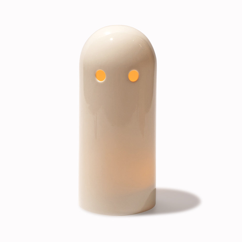 Porcelain Ghost Tea Light Holder lit on white by Studio Arhoj