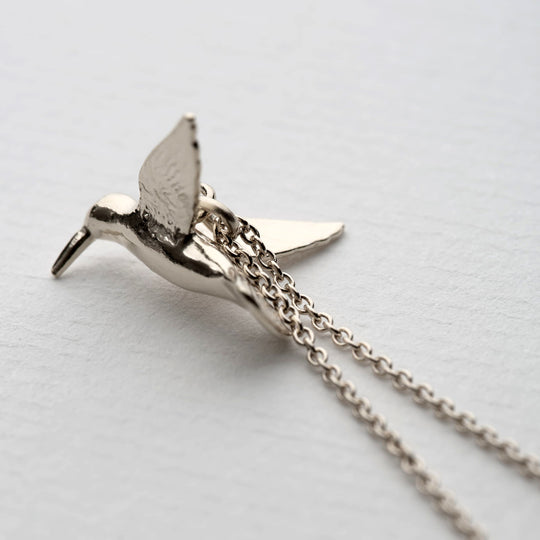 A delicately detailed flying hummingbird necklace from Alex Monroe's Classics jewellery collection.