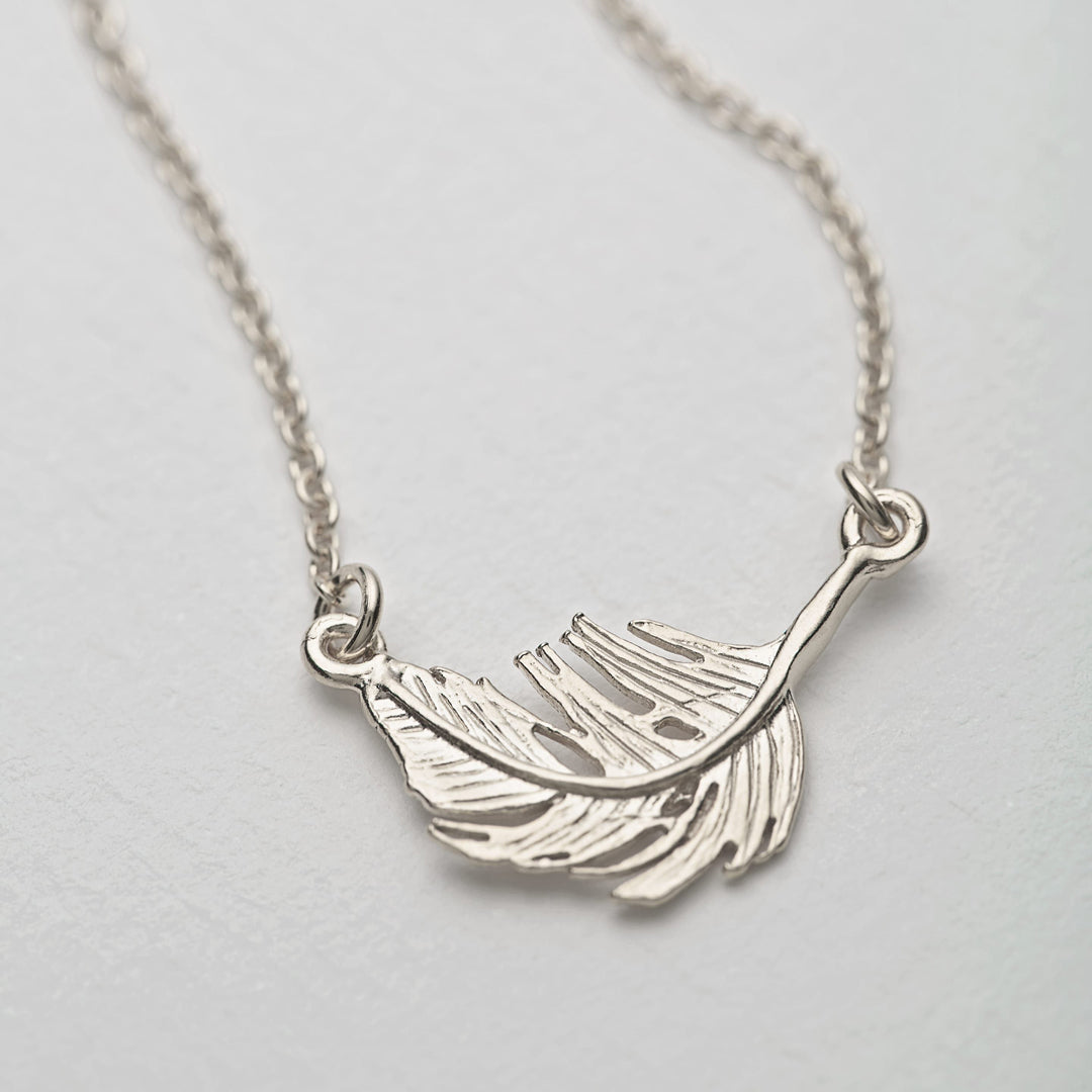 A delicately detailed floating feather in-line necklace from Alex Monroe's Classics jewellery collection.