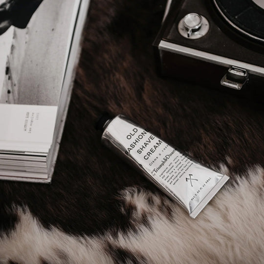 Triumph & Disaster Old Fashioned Shave Cream delivers a great super smooth and close shave without any of the nasties we now frown upon. lifestyle image on table