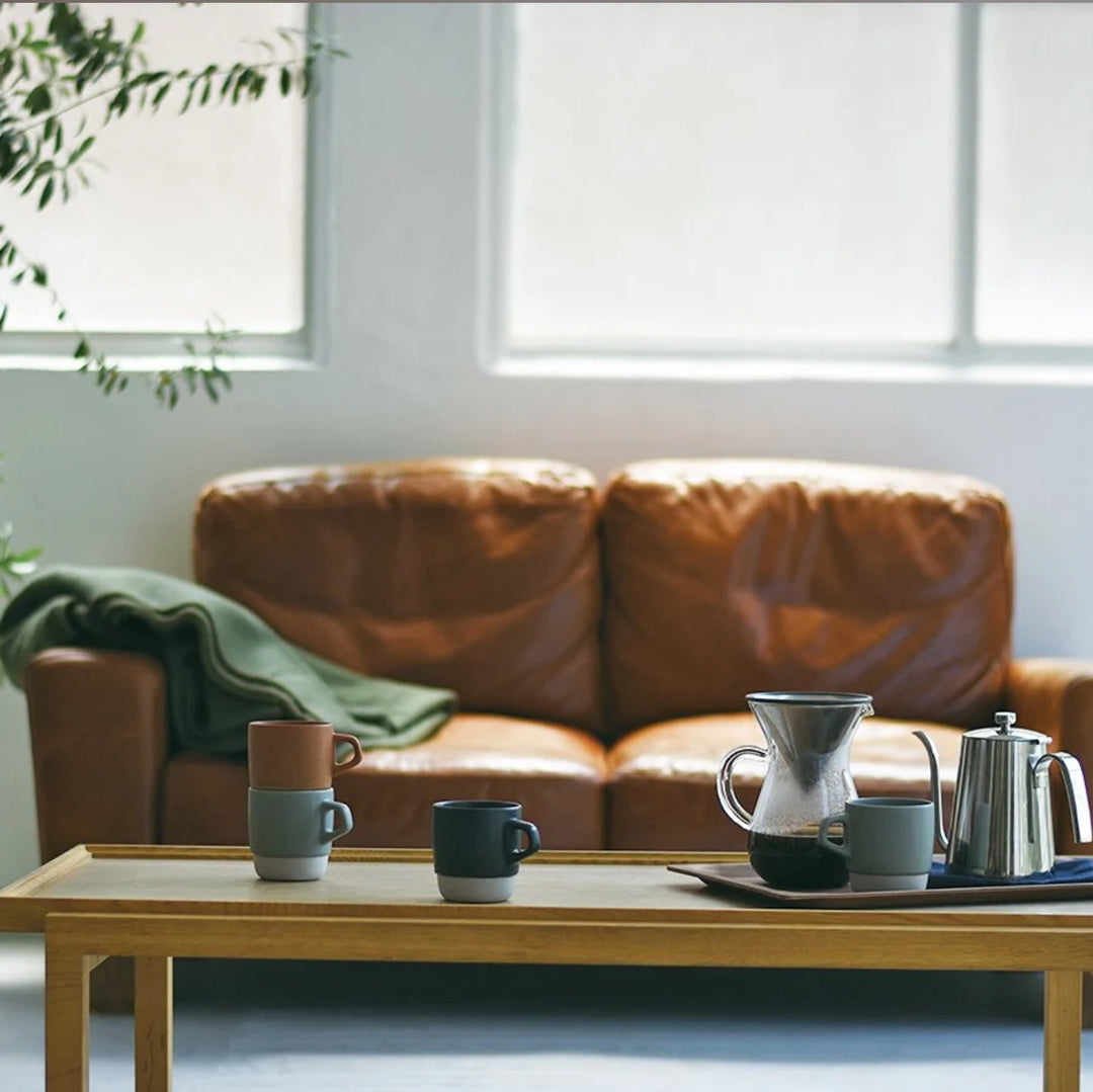 Kinto Tableware and Drinkware Lifestyle image. Sofa and coffee table with slow coffee products.