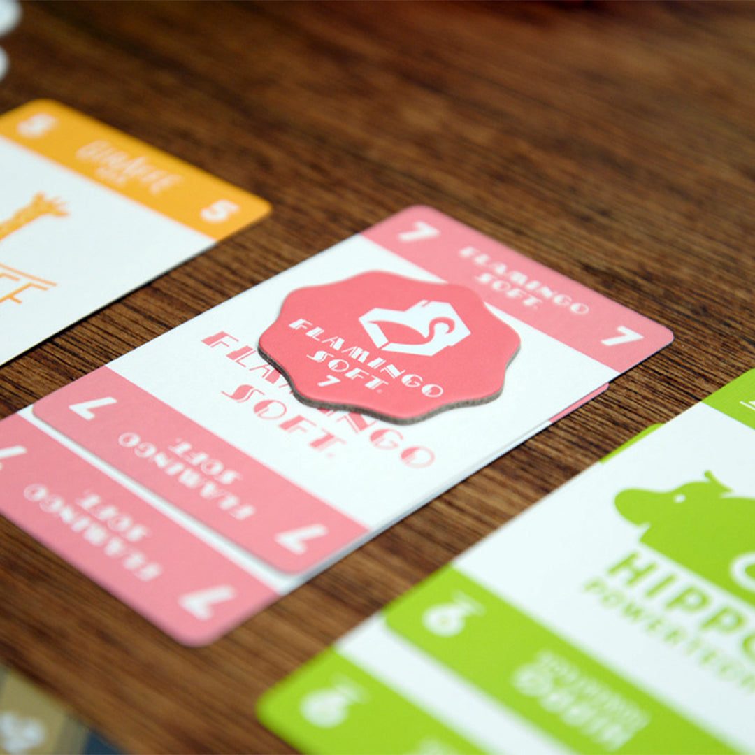 Startups Monopoly Token by Oink Games Japan on a table background