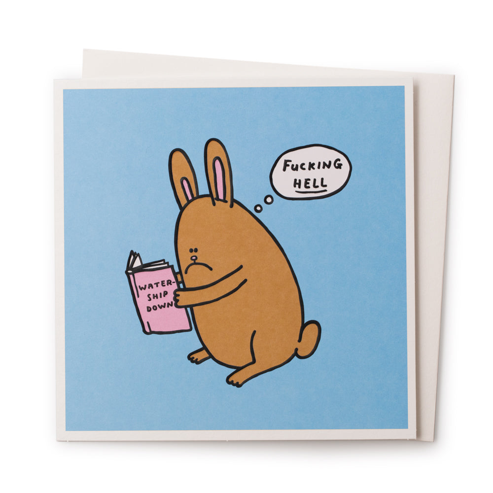 Watership Downer' is a funny illustrative greeting card by Al Murphy for USTUDIO featuring a sad faced bunny rabbit thinking an expletive, whilst reading a copy of the classic animal themed novel 'Watership Down' by Richard Adams.