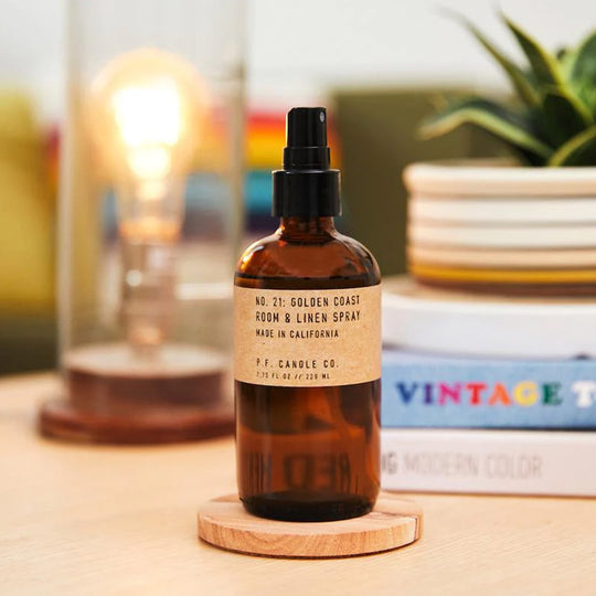 PF Candle Co Golden Coast Room and Linen Spray. Supplied in apothecary inspired amber glass bottles with their signature kraft label, part of PFCandleCo core collection. Detail im age
