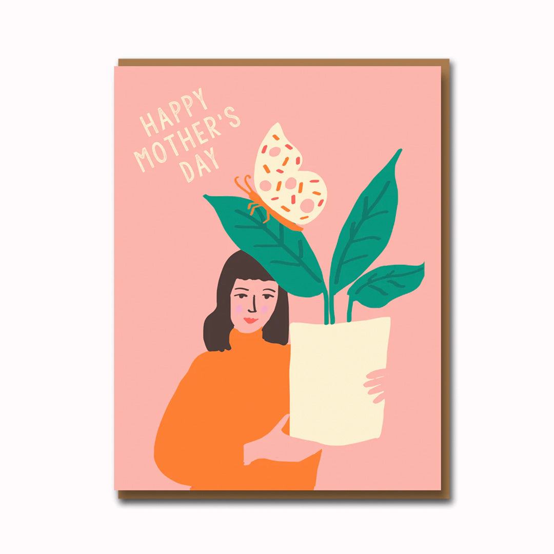 Simple, cute and quirky Mother's Day card of a butterfly on a plant being held up, playfully illustrated by one half of the 1973 team Emma Cooter.