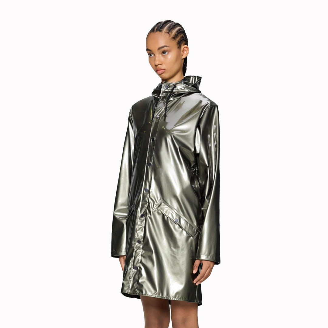 As Worn - This rain jacket is a long version of Rains' classic rain jacket, it features a placket with snap fastenings for closure, hood with built-in cap and two side pockets with snaps. Sleeves are finished with snaps making them adjustable for a loose or tight fit.