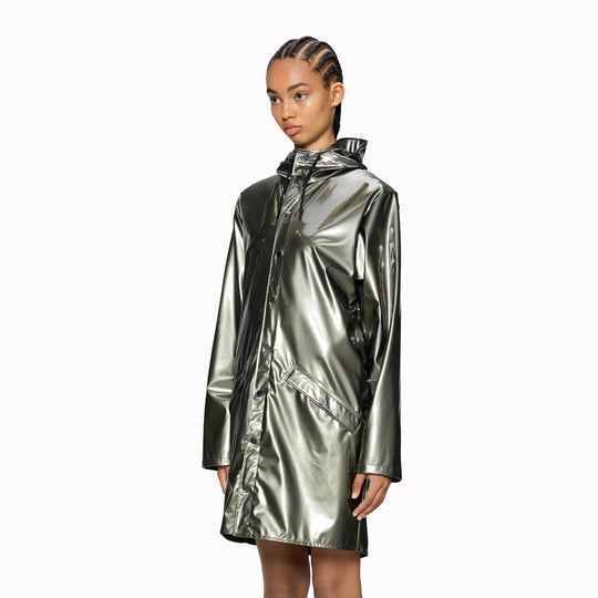 As Worn - This rain jacket is a long version of Rains' classic rain jacket, it features a placket with snap fastenings for closure, hood with built-in cap and two side pockets with snaps. Sleeves are finished with snaps making them adjustable for a loose or tight fit.