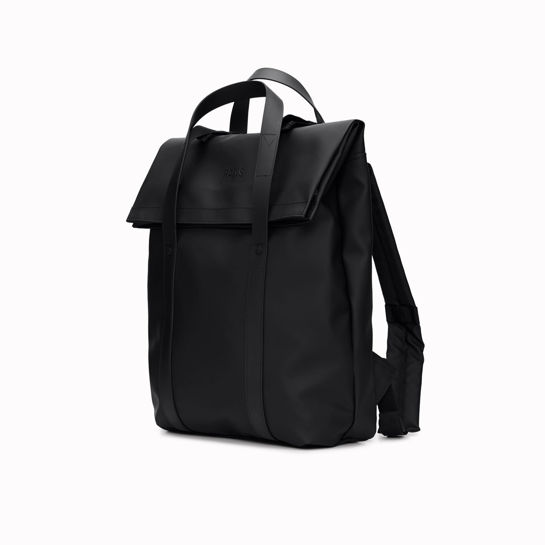 The Rains 2 Way Tote Backpack is characterised by a fold-top opening with the addition signature TPU strap details with top handles.