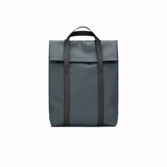 The Rains 2 Way Tote Backpack is characterised by a fold-top opening with the addition signature TPU strap details with top handles.