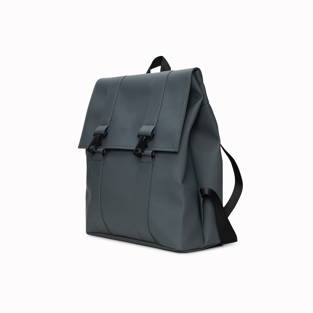 Rains' MSN Bag W3 is their interpretation of the classic school backpack, reimagined for commuters. A minimal silhouette with dual strap and carabiner closure. Made from Rains’ signature waterproof fabric