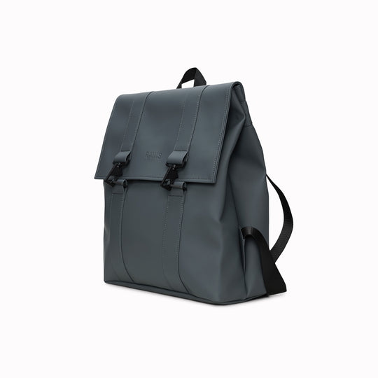 Rains' MSN Bag W3 is their interpretation of the classic school backpack, reimagined for commuters. A minimal silhouette with dual strap and carabiner closure. Made from Rains’ signature waterproof fabric