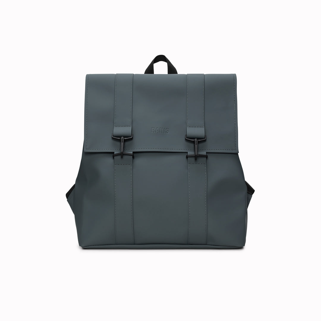 Rains' MSN Bag W3 is their interpretation of the classic school backpack, reimagined for commuters. A minimal silhouette with dual strap and carabiner closure. Made from Rains’ signature waterproof fabric