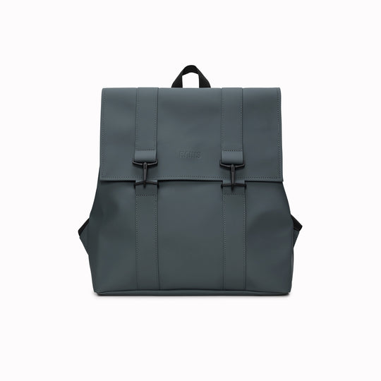 Rains' MSN Bag W3 is their interpretation of the classic school backpack, reimagined for commuters. A minimal silhouette with dual strap and carabiner closure. Made from Rains’ signature waterproof fabric