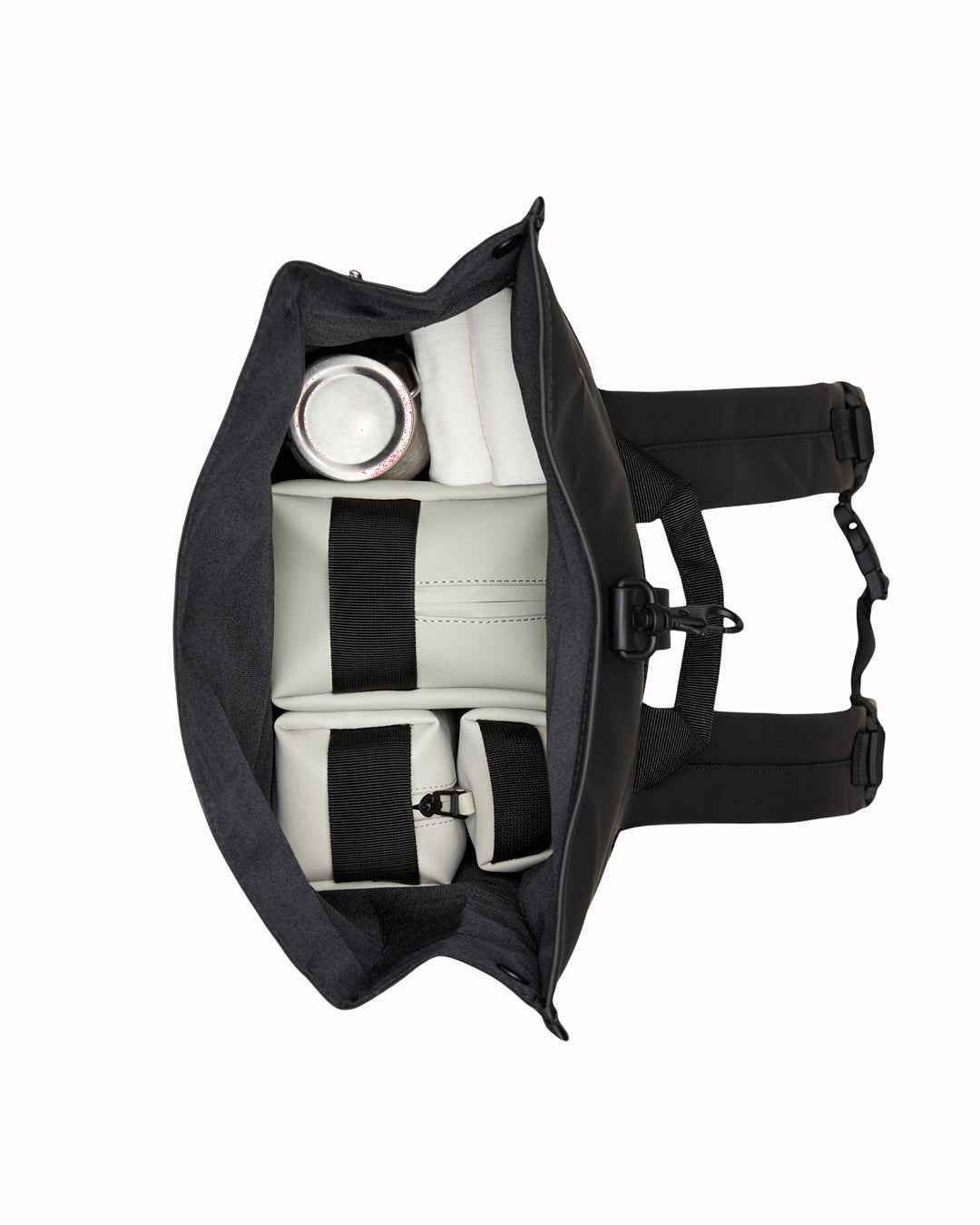 The Rolltop Rucksack is one of Rains' signature designs, built around a simple rolltop closure that offers flexible storage and dependable weather protection.