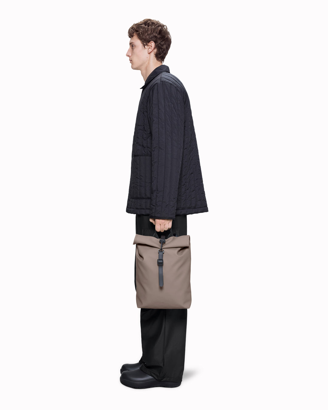 The Rolltop Rucksack Mini takes Rains' signature backpack design and scales it down into a more compact format.
