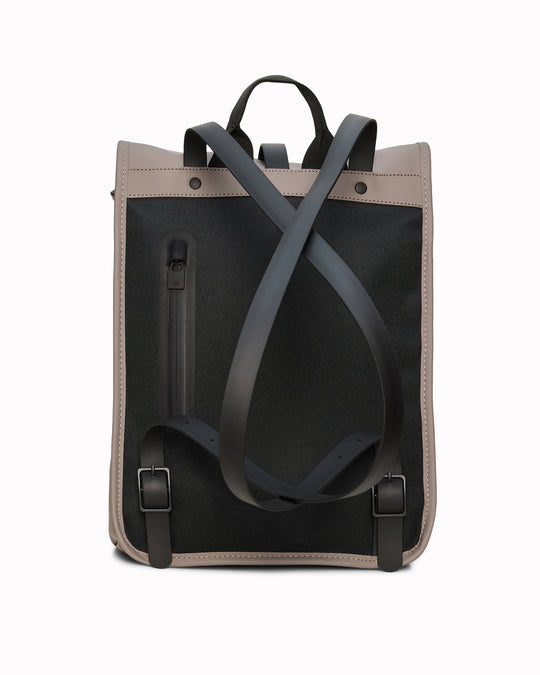 The Rolltop Rucksack Mini takes Rains' signature backpack design and scales it down into a more compact format.