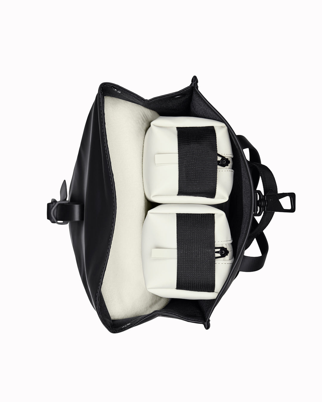 The Rolltop Rucksack Mini takes Rains' signature backpack design and scales it down into a more compact format.