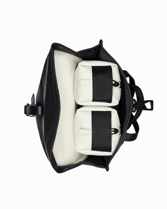 The Rolltop Rucksack Mini takes Rains' signature backpack design and scales it down into a more compact format.
