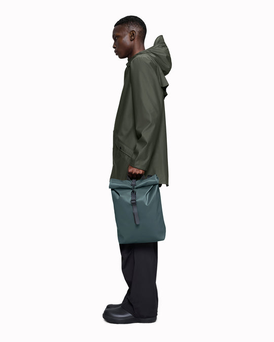 The Rolltop Rucksack Mini takes Rains' signature backpack design and scales it down into a more compact format.