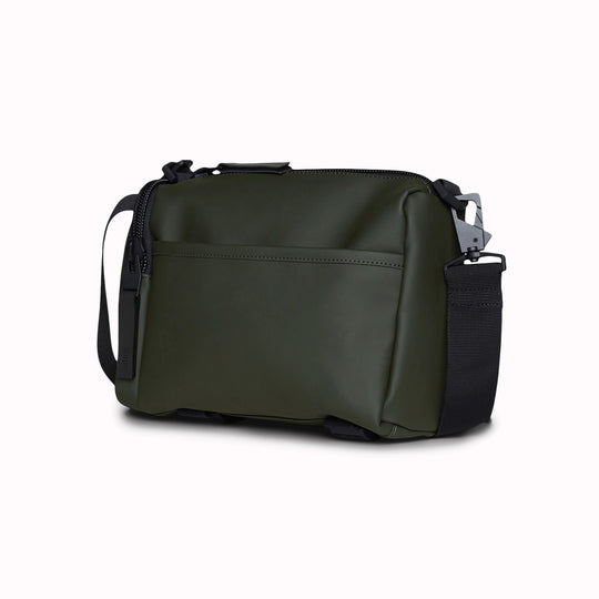 The Rains Texel Crossbody bag in green is a sleek and functional accessory designed for travel and everyday use. Crafted from Rains' signature waterproof matte-shell material, this bag offers durable protection against the elements.