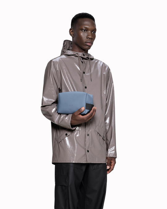 The small unisex wash bag by Rains&nbsp;features one main compartment with inside sleeve pockets and is large enough to fit one’s essential toiletries. 