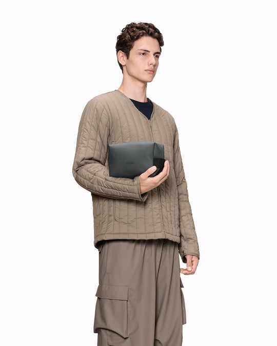The small unisex wash bag by Rains&nbsp;features one main compartment with inside sleeve pockets and is large enough to fit one’s essential toiletries.