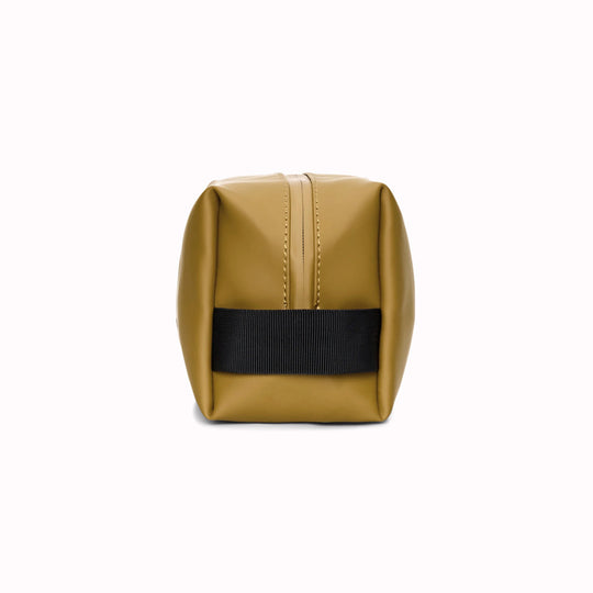 Side View - SS26 Wash Bags by Rains in their new season Dawn colourway. A cube shaped wash bag with one main compartment with inside sleeve pockets and is large enough to fit one’s essential toiletries.
