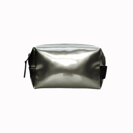 SS26 Wash Bags by Rains in their new season metallic silver Raven colour. A cube shaped wash bag with one main compartment with inside sleeve pockets and is large enough to fit one’s essential toiletries. 