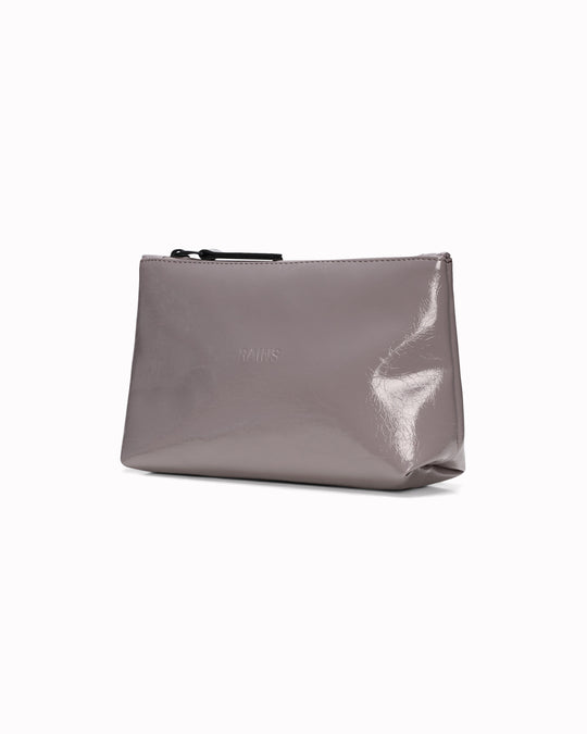 A compact wash bag with the clean, understated design Rains is known for. The Cosmetic Bag pares things back to a single compartment, with a softly structured silhouette