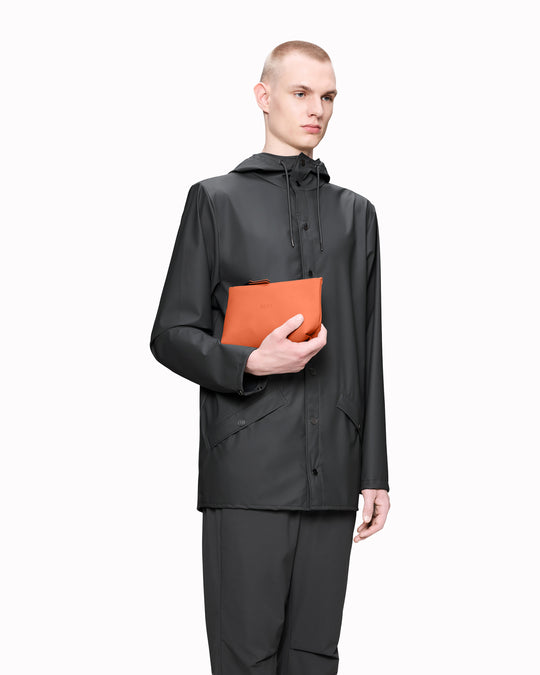 A compact wash bag with the clean, understated design Rains is known for. The Cosmetic Bag pares things back to a single compartment, with a softly structured silhouette