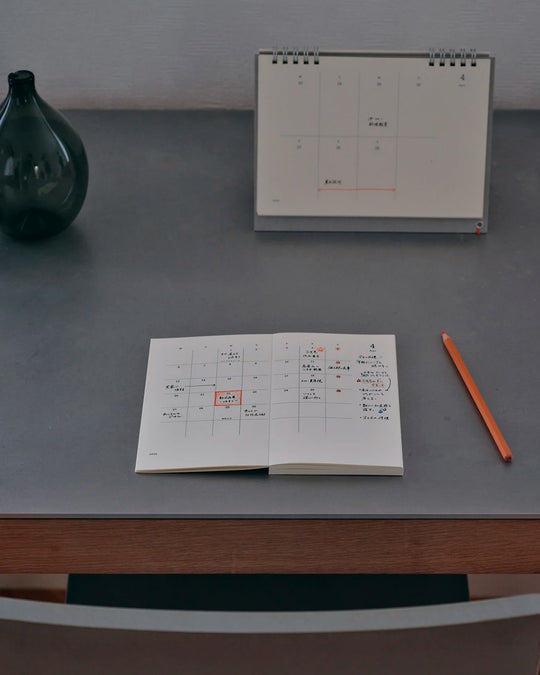 The diary includes block type monthly schedule pages and pages divided into eight sections across a two-page spread for use as a weekly schedule.