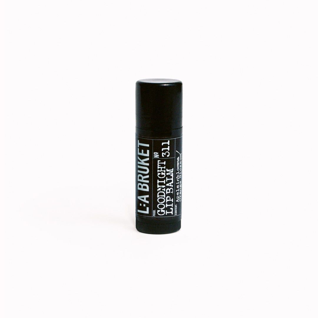 The L:A Bruket 2025 Nightfall Winter Gift Kit contains a soothing duo to wind down the day and prepare for a good night of sleep: 313 Candle Beach Fire 50g and 311 Goodnight Orange Blossom Lip Balm 14g