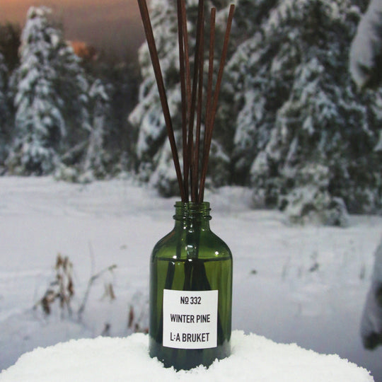 room diffuser blending a long-lasting vegan base with a fresh burst of pine needle and rosemary evoking the crisp air of untouched wilderness
